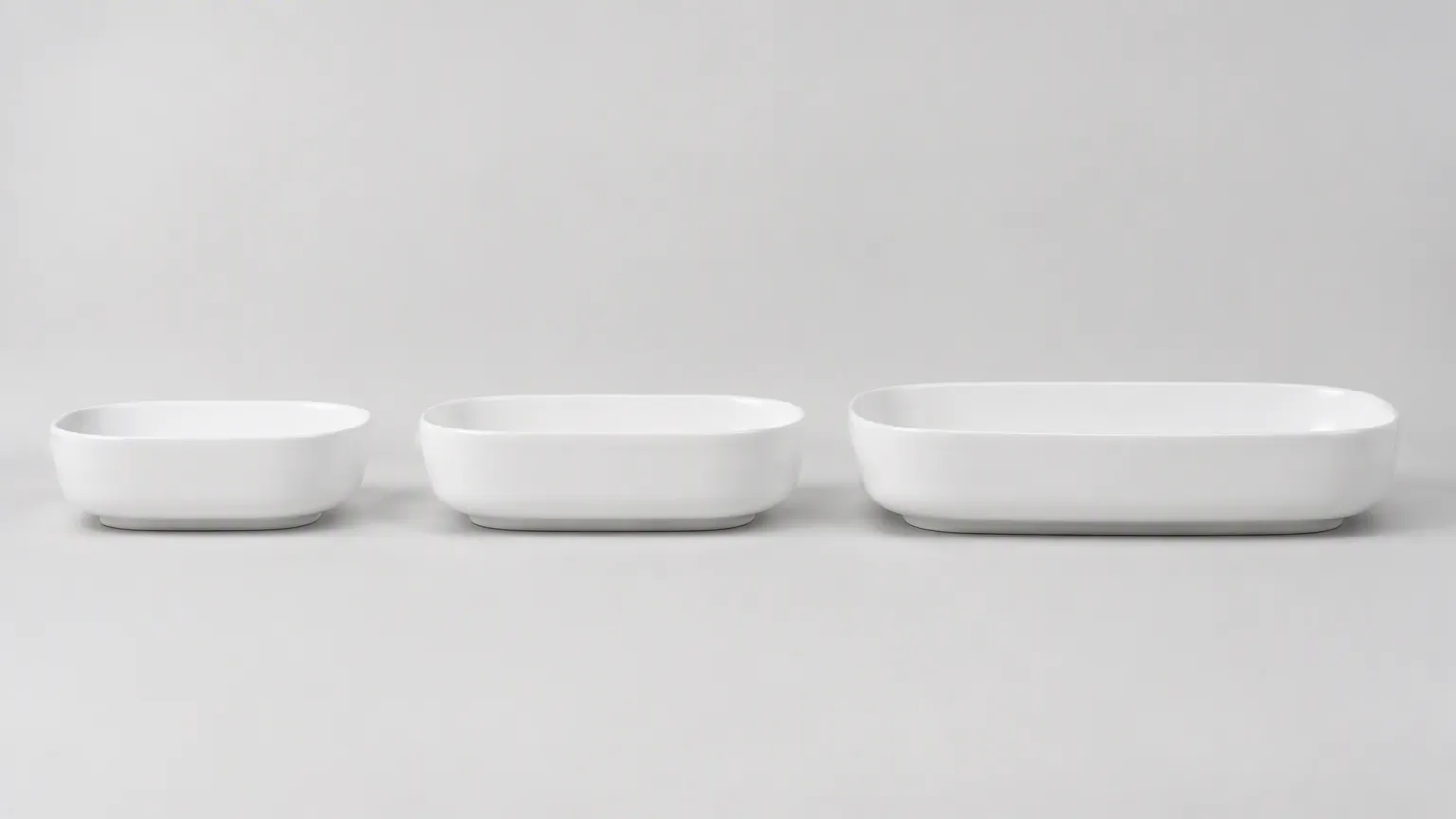 Side profile comparison of round front, elongated, and compact elongated porcelain toilet bowls